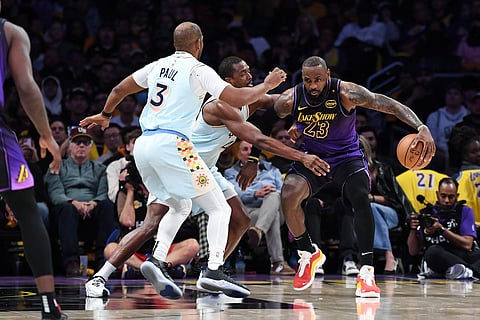 Chris Paul #3 of the San Antonio Spurs plays defense during the game against the Los Angeles Lakers on January 13, 2025 at Crypto.Com Arena in Los Angeles, California.