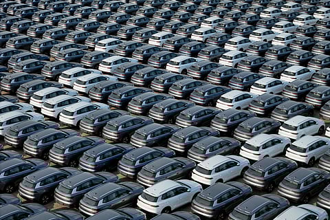 (FILES) This photo taken on 18 April 2024 shows BYD electric cars for export waiting to be loaded onto a ship at a port in Yantai, in eastern China's Shandong province. Sales of electric and hybrid vehicles jumped more than 40 percent in China in 2024, as demand for new energy models continues to surge and the sector remains entrenched in a gruelling price war.