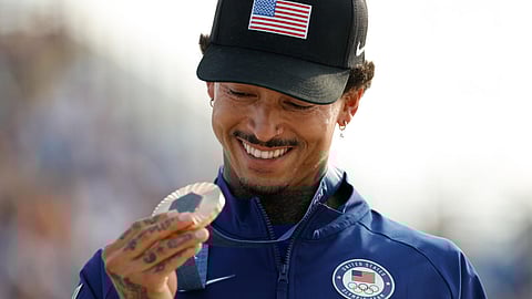 Nyjah Huston holds his bronze medal after the victory ceremony for the men's street skateboarding event on July 29, 2024.