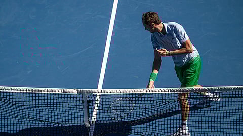 Daniil Medvedev smashes his racket during his nail-biting five-set win over wildcard bet Kasidit Samrej of Thailand in the opening round of the men’s singles event of the Australian Open.