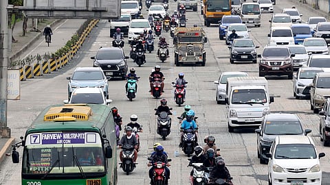 (FILE PHOTO) (December 17, 2024) On Tuesday, December 17, 2024, motorcycle taxis were seen plying Commonwealth Avenue in Quezon City. The Land Transportation Franchising and Regulatory Board (LTFRB) has issued a show cause order (SCO) to two of the three ride-hailing companies operating in the national capital for allegedly exceeding the government's limit on the number of motorcycle taxi riders. Photo/Analy Labor