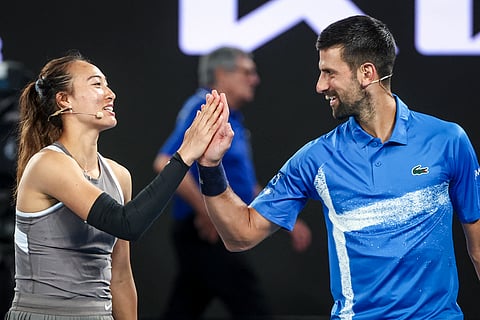 Serbia’s Novak Djokovic (R) reacts with China’s Zheng Qinwen during a charity event titled ‘Night with Novak’ on Rod Laver Arena in Melbourne on 9 January 2025 ahead of the Australian Open tennis championship starting on 12 January.