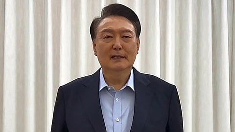 This handout photo taken and released by the South Korean Presidential Office via Yonhap early on January 15, 2025 shows South Korean impeached president Yoon Suk Yeol speaking during a video message to the public at his residence in Seoul.
