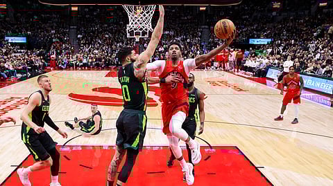 RJ Barrett of the Toronto Raptors drives past Jayson Tatum of the Boston Celtics during their 110-97 win in the NBA regular season.