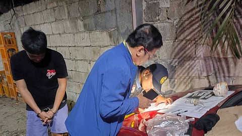POLICE examine the P2.3 million worth of shabu found in the possession of a suspect who tried to elude arrest when he sped away from a checkpoint in Arayat, Pampanga Friday.