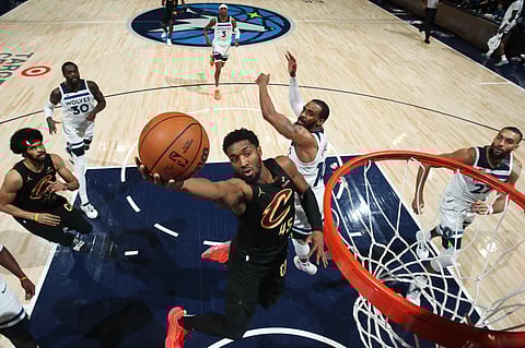 Donovan Mitchell attacks the basket en route to a 36-point showing in the Cleveland Cavaliers’ 124-117 win over the Minnesota Timberwolves on Saturday in their NBA regular season game.
