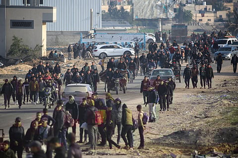 Journey back home As the war-weary streets of Rafah beckon the displaced, a fragile peace blooms in the aftermath of the Israel-Hamas ceasefire deal on Sunday. The hopeful people, their faces etched with sorrow and relief, trudges forward, each step a quiet testament to survival.