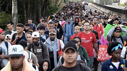 Migrants from a caravan in Tapachula, Chiapas state, Mexico, march while heading to the US border on 20 January 2025. US President Donald Trump was sworn in for a historic second term pledging a blitz of immediate orders on immigration aimed at re-shaping how the United States deals with citizenship and immigration, and the US culture wars as he caps his extraordinary comeback.