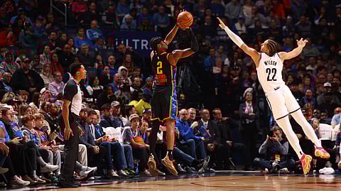 Shai Gilgeous-Alexander #2 of the Oklahoma City Thunder shoots a three point basket during the game against the Brooklyn Nets on 19 January 2025 at Paycom Center in Oklahoma City, Oklahoma.