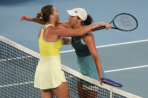 USA's Madison Keys (R) hugs Belarus' Aryna Sabalenka after winning their women's singles final match on day fourteen of the Australian Open tennis tournament in Melbourne on 25 January 2025.