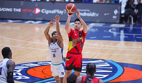 Juami Tiongson flexes his shooting prowess during San Miguel’s 116-113 victory over Converge on Friday in their PBA Commissioner’s Cup game at the Ynares Center in Antipolo.