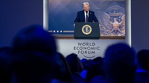 US President Donald Trump is seen on a large screen during his address by video conference at the World Economic Forum annual meeting in Davos.