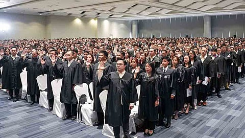 Raising the bar Newly minted Filipino lawyers take their oath to uphold the ideals of justice and the rule of law as officers of the court.