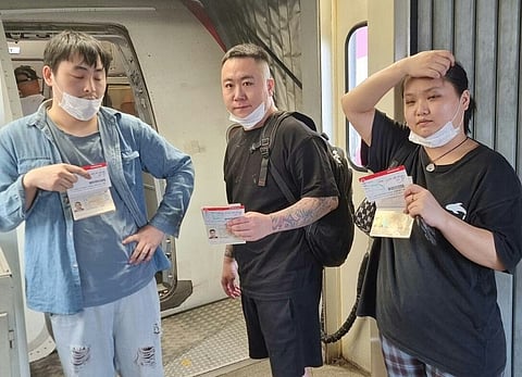 Three Chinese nationals, recently apprehended for involvement with an illegal POGO operation, were deported on January 25 and boarded an AirAsia flight bound for Xiamen, China.