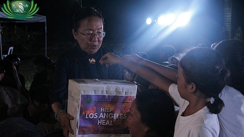 YOUNG donors put coins on a donation box for victims of wildfires in Los Angeles, California during the Tzu Chi Foundation year-end blessing ceremony in Liloan, Ormoc, Leyte.