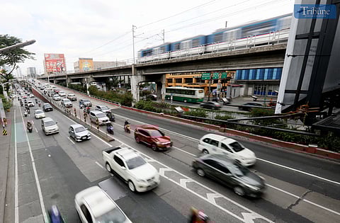 (FILE) Moderate traffic situation at EDSA in Kamuning, Quezon City, on Tuesday, 28 January 2025. The expanded number coding scheme on Wednesday, 29 January, is suspended for the Chinese New Year celebration, the Metropolitan Manila Development Authority (MMDA) said.