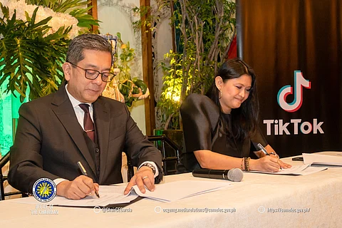 Comelec Chairperson George Erwin Garcia and TikTok’s public policy manager Peachy Paderna