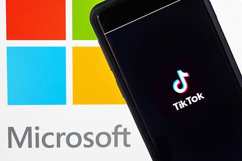 In this photo illustration, a mobile phone featuring the TikTok app is displayed next to the Microsoft logo on August 03, 2020 in New York City. Under threat of a U.S. ban on the popular social media app, it has been reported that Microsoft is considering taking over from Chinese firm ByteDance. (Photo Illustration by Cindy Ord/Getty Images)
Cindy Ord / GETTY IMAGES NORTH AMERICA / Getty Images via AFP