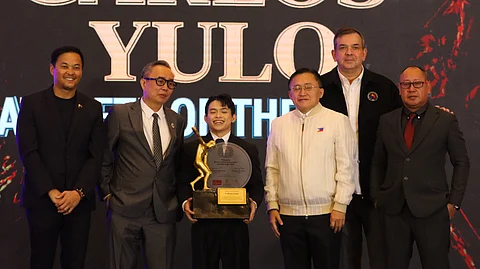 Carlos Yulo (middle) shares his Athlete of the Year Award with Rep. Mikee Romero, POC president Abraham ‘Bambol’ Tolentino, Sen. Christopher ‘Bong’ Go, PSC chairman Richard ‘Dickie’ Bachmann and PSA president Nelson Beltran during the 2024 PSA Annual Awards Night late Monday at the Centennial Hall of the Manila Hotel.