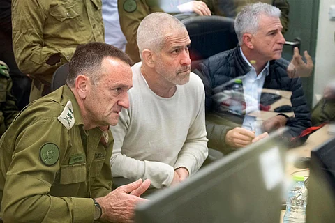 This handout picture released by the Israeli army shows (L to R) Israeli army Chief of the General Staff Lieutenant-General Herzi Halevi, Israel Security Agency (ISA, also known as Shin Bet) director Ronen Bar, and Israeli intelligence agency Mossad director David Barnea at the Hostages and Missing Persons situation room during the return of the four hostages from Gaza on January 25, 2025.
Israeli Army / AFP