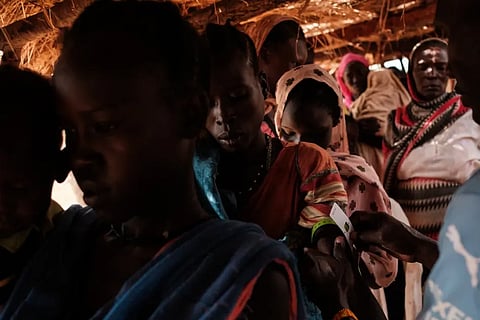A woman has her arm measured during a malnutrition checkup at a medical center in a camp for internally displaced persons in South Kordofan state, Sudan, on June 17, 2024.