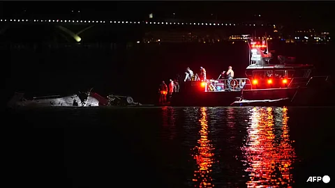 Emergency response units assess helicopter wreckage in the Potomac River near Ronald Reagan Washington Airport on Jan 30, 2025 in Arlington, Virginia.