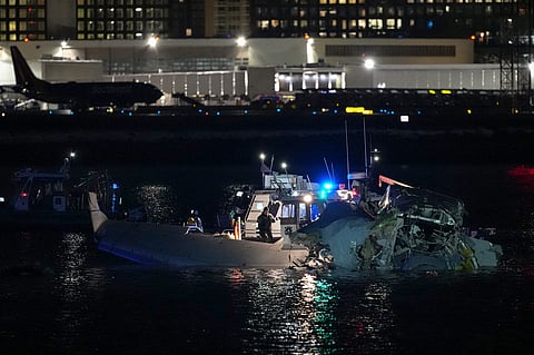 LOOK: Emergency response units assess airplane wreckage in the Potomac River near Ronald Reagan Washington Airport on January 30, 2025 in Arlington, Virginia. An American Airlines flight from Wichita, Kansas collided with a helicopter while approaching Ronald Reagan National Airport.