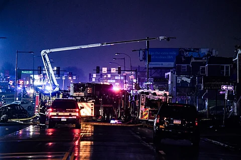 Emergency service members respond to a plane crash in a neighborhood near Cottman Avenue on 31 January 2025 in Philadelphia, Pennsylvania. The plane, a medical transport jet carrying a child patient, crashed after taking off from Northeast Philadelphia Airport, damaging several homes and vehicles.
