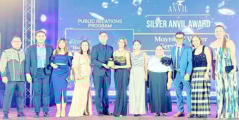 THE Maynilad team, led by Central Non-Revenue Water head Engr. Ryan Jamora, and corporate affairs and communication head Marie Antonette De Ocampo (5th and 6th from left, respectively), proudly receives the Silver Anvil Awards for the company’s NRW reduction communication initiatives.
