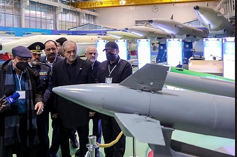 In this handout picture President Masoud Pezeshkian (C) visits a defence and space achievements exhibition in Tehran.