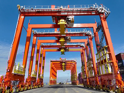 Photo shows the eight new near-zero emission (NZE) rubber-tired gantries at the Manila International Container Terminal (MICT), the first of their kind in the Philippines.