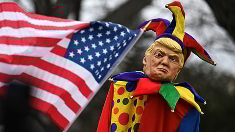 An effigy of US President Donald Trump dressed as a jester is seen as people protest against the administration's decision to virtually shut down the United States Agency for International Development (USAID) at the US Capitol in Washington, DC, on 5 February 2025. The US government's giant humanitarian agency USAID on 4 February 2025 announced it was placing its staff in the United States and around the world on administrative leave as it moved to recall employees from overseas postings. The agency said in a statement on its website -- which reappeared Tuesday after going dark over the weekend -- that the staff leave will begin shortly before midnight on 7 February.