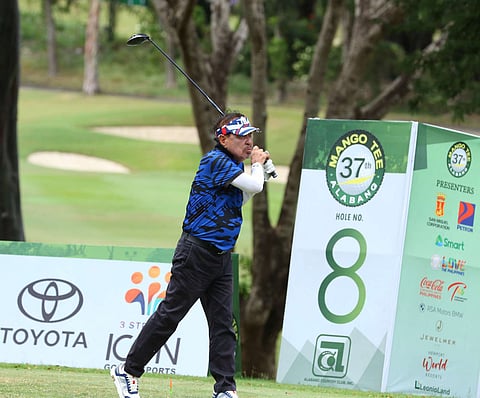 DAILY TRIBUNE President Willie Fernandez tees off at Hole No. 8 during the 37th Mango Tee Invitational yesterday at the Alabang Country Club. Fernandez scored 41 points.