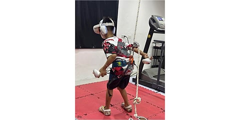 A patient with cerebral palsy participates in the trial phase of AXEL’s Virtual Reality game, “Mission to Planet AXEL."