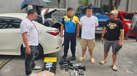 POLICE operatives accost an alleged gun trafficker (second from left) in a buy-bust operation along Chino Roces Avenue Extension in Barangay Magallanes in Makati on Friday.
