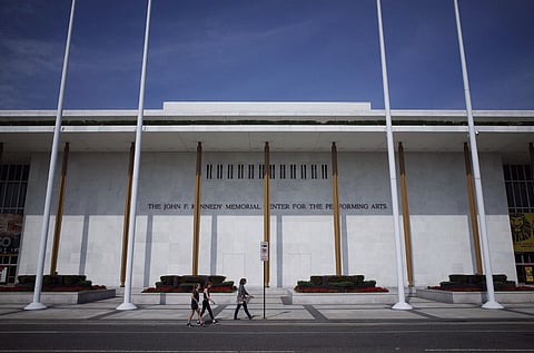 (FILES) Pedestrians walk up a sidewalk to the John F. Kennedy Center for the Performing Arts on 16 August 2014 in Washington, DC. US President Donald Trump announced 7 February 2025, he will name himself to be chairman of the Kennedy Center, putting his aggressive rightwing stamp on Washington's premier cultural venue. Trump broke the news in a post on his social media platform.