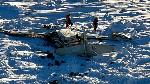 This image obtained from the US Coast Guard (USCG) on February 7, 2025, shows the remains of a plane reported missing February 6. The Bering Air Caravan was carrying nine passengers and one pilot on board. The search ended after the aircraft was located some 34 miles (55kms) southeast of Nome, Alaska. The USCG reported the three individuals were found inside and were deceased.