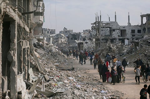 People head towards their homes in the Shijaiyah neighborhood, Gaza City, on January 28, 2025. Displaced Palestinians return following a ceasefire, finding their neighborhoods in ruins.