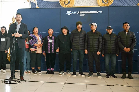 Thai Foreign Minister Maris Sangiampongsa (L) speaks as Thai nationals Surasak Rumnao, Sayhian Suwannkham, Bannawat Saethao, Watchara Sriaoun and Pongsak Thaenna look on during a press conference after their return to Thailand at Bangkok's Suvarnabhumi Airport on 9 February 2025, following their release in a hostage-prisoner exchange between Israel and Hamas as part of a ceasefire deal.