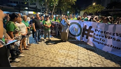 Supporters of VP Sara Duterte wearing green and holding candles, gather at the Davao City’s Freedom Park for the Indignation Rally and Candle Lighting ceremony.