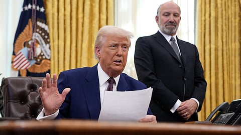 U.S. President Donald Trump, joined by Secretary of Commerce Howard Lutnick, delivers remarks on reciprocal tariffs in the Oval Office at the White House on 13 February 2025 in Washington, DC.