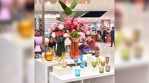 CLOCKWISE: Glass drinkware, red tablescape and Thomas tableware.