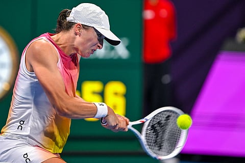 Iga Swiatek makes a powerful return during her quarterfinal duel with Elena Rybakina in the Qatar Open. Swiatek prevailed, 6-2, 7-5.