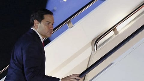 US Secretary of State Marco Rubio boards a plane as he departs Joint Base Andrews with him to the Munich Security Conference, Germany, from Joint Base Andrews, Maryland, US, on February 13, 2025.