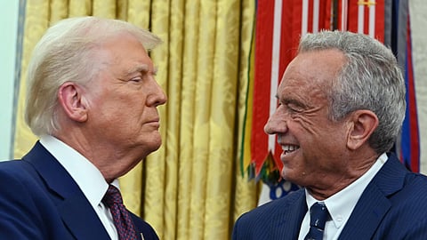 The new US Secretary of Health and Human Services Robert F. Kennedy Jr. shakes hands with President Donald Trump after a swearing-in ceremony at the White House