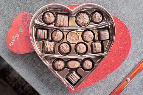 In this photo illustration, chocolates packaged for Valentine’s Day. Cocoa prices have surged over the past several years, recently reaching near record levels and driving up the cost of chocolate.