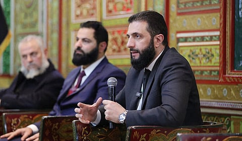 This handout picture released by the Syrian Presidency on February 16, 2025 shows Syria's interim leader Ahmed al-Sharaa attending a meeting with officials and local leaders in the western coastal city of Tartus.