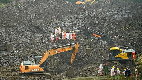 Rescuers work at the site of a landslide in Jinping village in the city of Yibin, in China’s southwest Sichuan province on 9 February 2025.