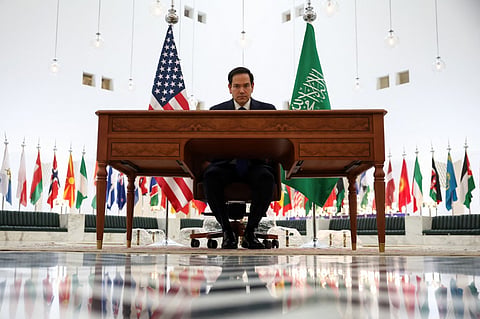 US Secretary of State Marco Rubio signs the guestbook while visiting the Saudi Foreign Ministry headquarters in Riyadh on 17 February 2025.