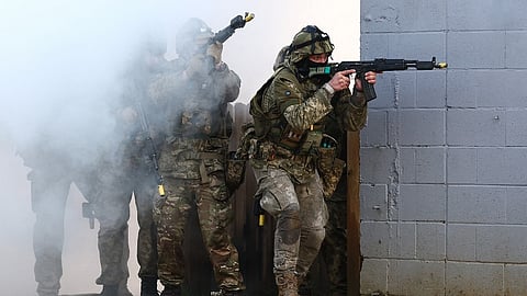 Ukrainian soldiers take part in a training excercise operated by Britain's armed forces as part of the Interflex programme, in eastern England, on February 24, 2024, on the second anniversary of the invasion of Ukraine by Russia. Britain announced on Saturday a new £245 million ($311 million) defence package to help boost the production of "urgently needed artillery ammunition" for Ukraine, two years after war broke out with Russia.